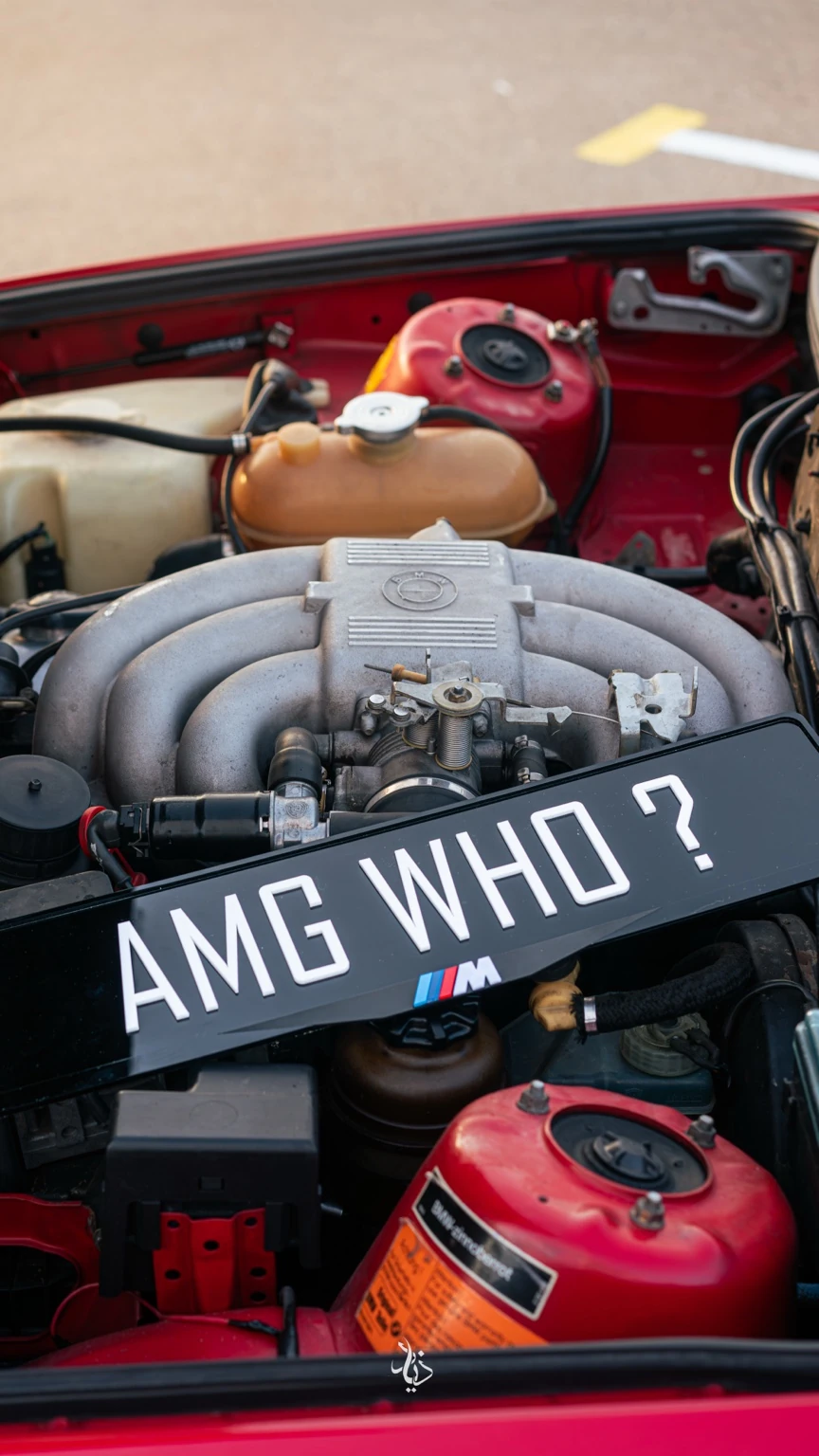 AMG WHO plate over the BMW engine